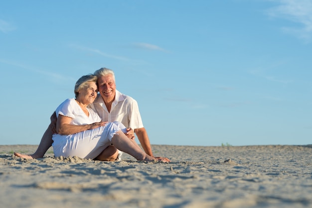 Portrait of a happy olderly woman holding gift