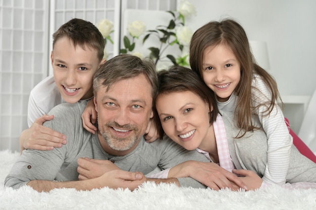 Portrait of a happy parents with kids at home