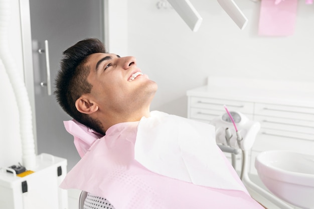 Portrait of happy patient in dental chair