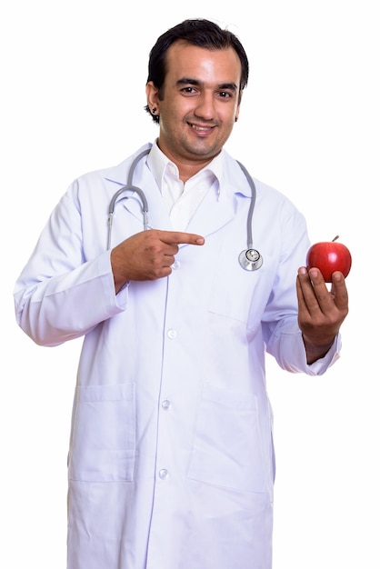 Portrait of happy Persian man doctor with red apple