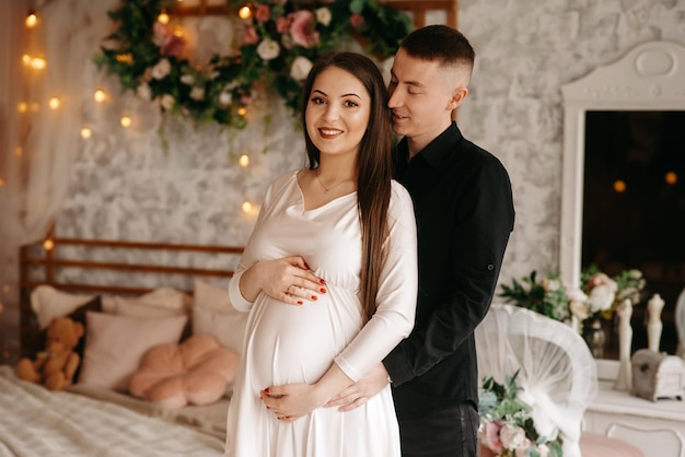 portrait of happy pregnant woman and her husband