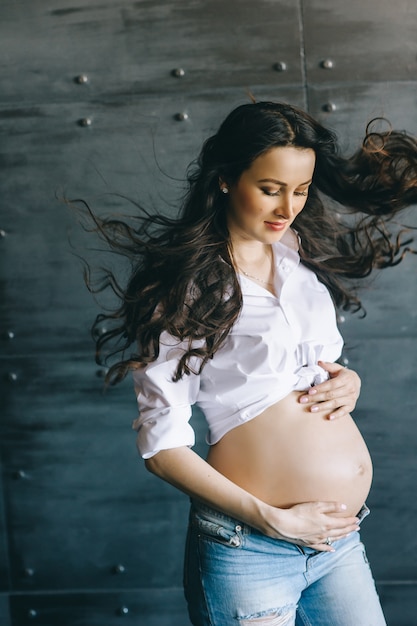 Portrait of a happy pregnant woman indoors