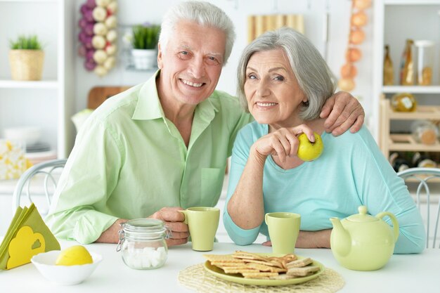 Portrait of a happy senior couple drinking tea