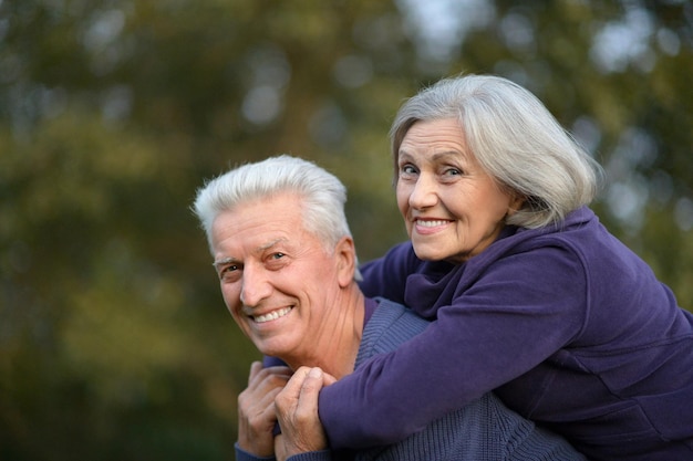 Portrait of a happy senior couple having fun outdoors