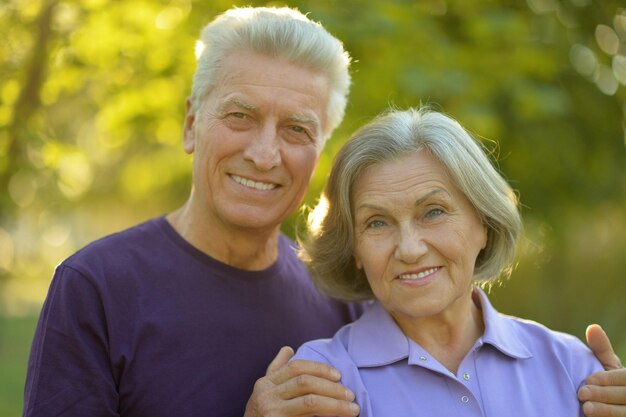 Portrait of a happy senior couple hugging outdoors