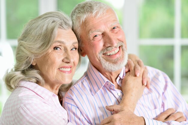 Portrait of a happy senior couple posing at home