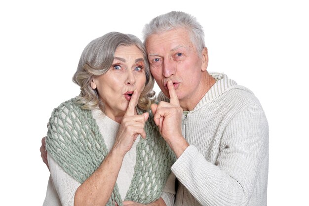 Portrait of happy senior couple posing on white background