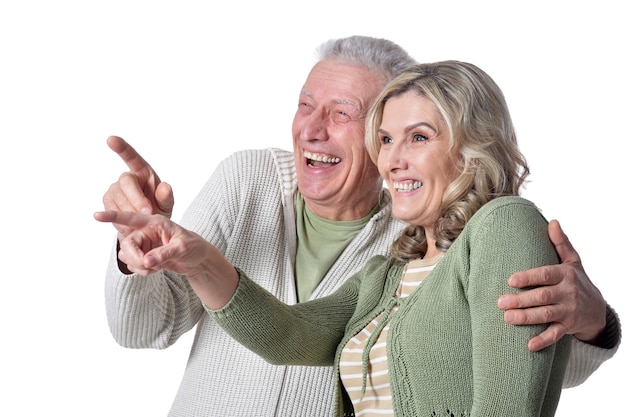 Portrait of happy senior couple posing on white background