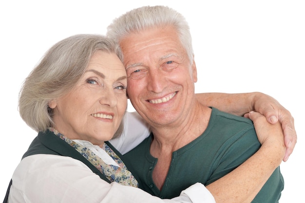 Portrait of happy senior couple posing on white background