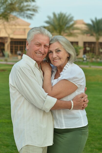 Portrait of a happy senior couple at tropic hotel resort