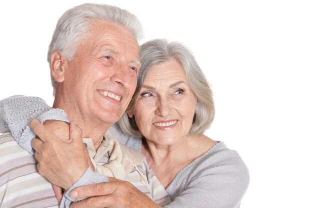 Portrait of a happy senior couple at white background