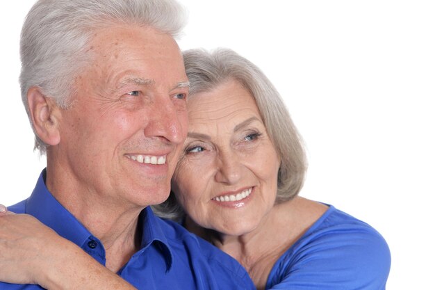 Portrait of happy senior couple on white background