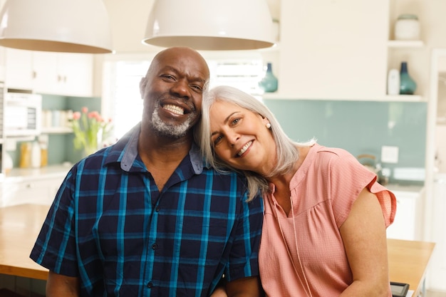 Portrait of happy senior diverse couple smiling