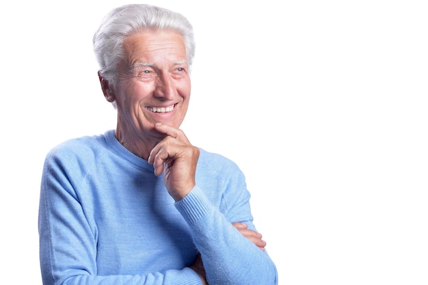 Portrait of happy senior man posing isolated