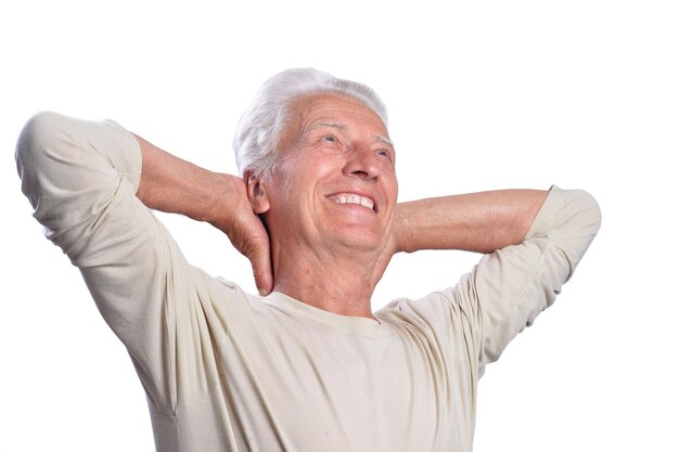 Portrait of happy senior man posing on white background