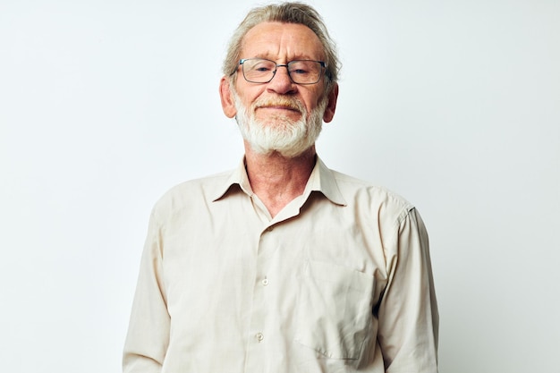 Portrait of happy senior man wears glasses in shirts light background