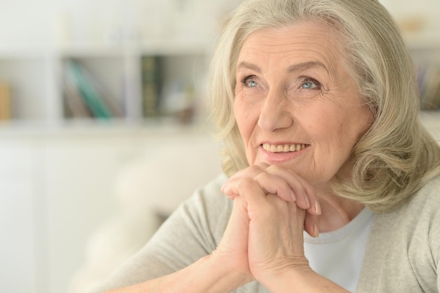 Portrait of happy senior woman at home