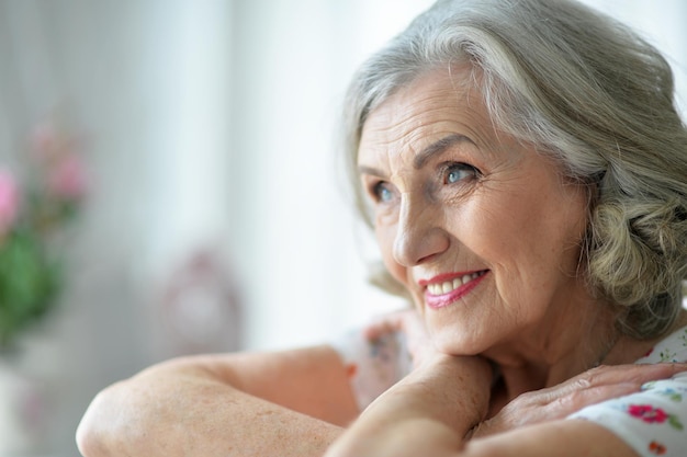 portrait of happy senior woman at home