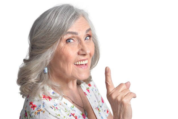 Portrait of happy senior woman posing isolated on white background