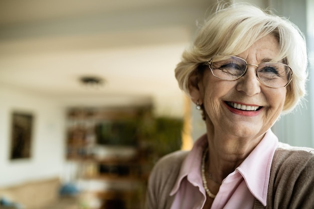 Portrait of happy senior woman relaxing at home Copy space