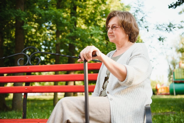 Portrait of a happy Senior woman in summer park