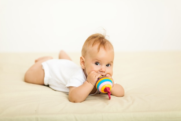 Portrait of happy smile baby relaxing on the bed