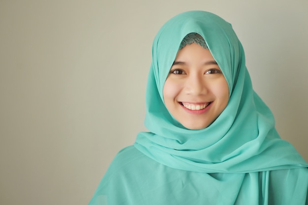 Portrait of happy smiling asian muslim woman