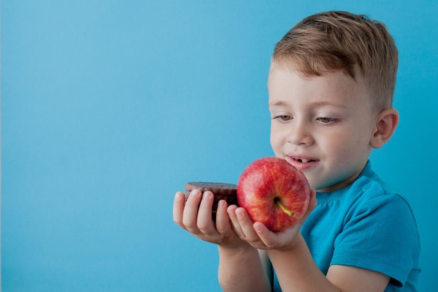 Portrait happy, smiling boy choosing junk food