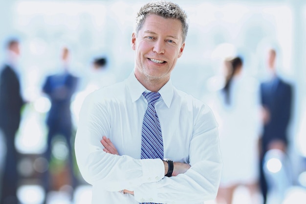 Portrait of happy smiling businessman in a modern office