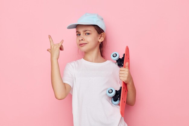 Portrait of happy smiling child girl posing white tshirt emotion isolated background