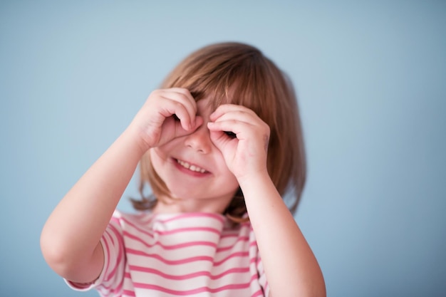 portrait of happy smiling child at home while playing