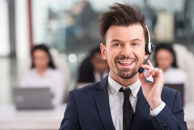 Portrait of happy smiling customer support phone.