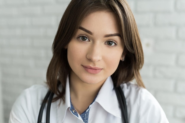 Portrait of happy smiling doctor woman with stethoscope