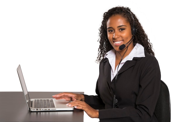 Portrait of happy smiling female customer support computer operator isolated