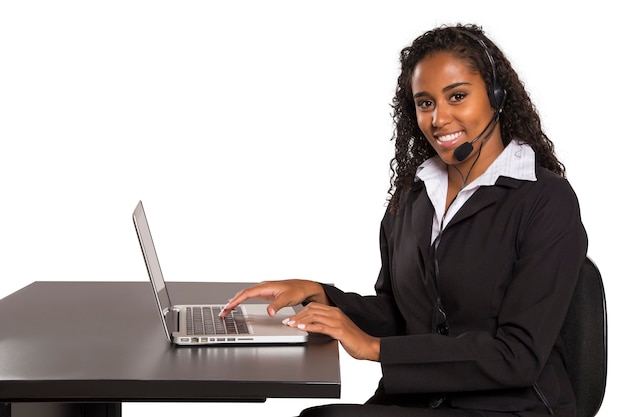 Portrait of happy smiling female customer support computer operator isolated