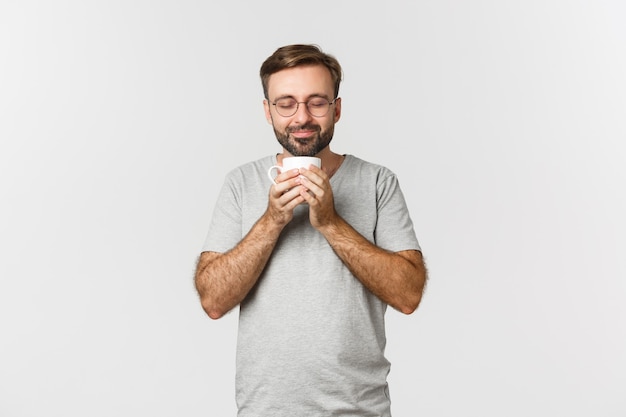 Portrait of happy smiling man in glasses and casual t-shirt