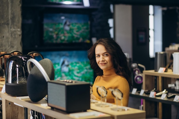 Portrait of happy smiling woman shopping a new smart watch in tech store Technology people concept