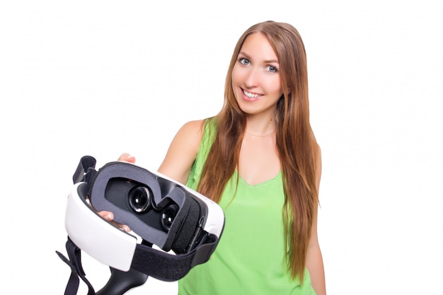 Portrait of happy smiling young beautiful girl getting experience using VR-headset glasses of virtual reality isolated