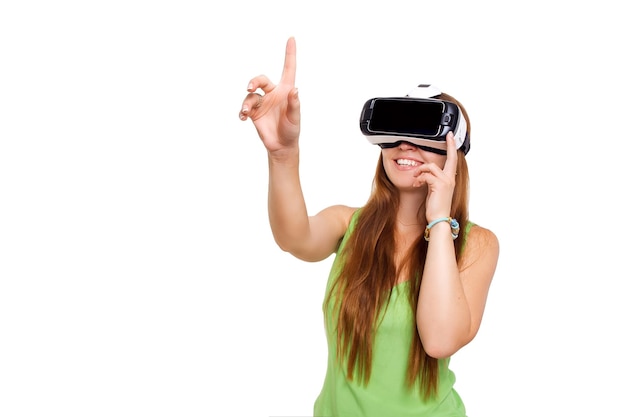 Portrait of happy smiling young beautiful girl getting experience using vrheadset glasses of virtual