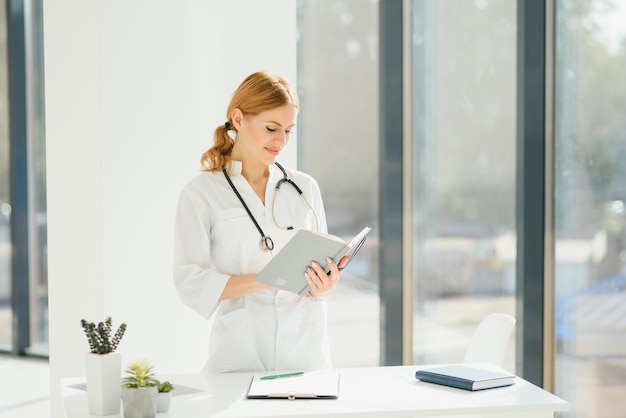 Portrait of happy successful female doctor