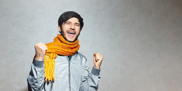 Portrait of happy successful young man