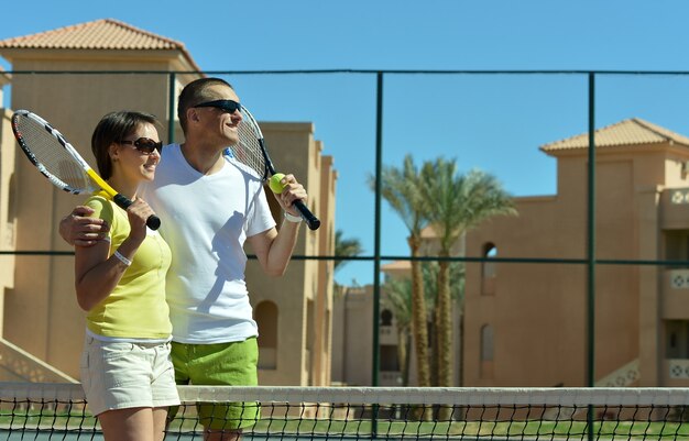 Portrait of a happy tennis players court