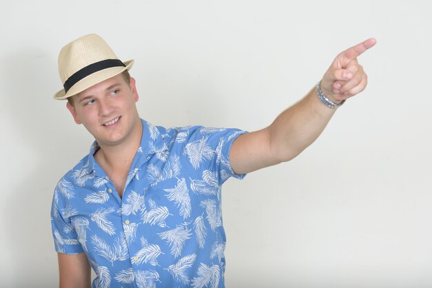 Portrait of happy tourist man with blond hair