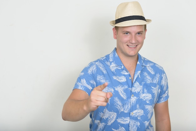 Portrait of happy tourist man with blond hair