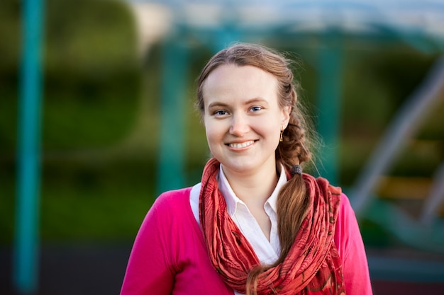 Portrait of happy white woman who is walking outside