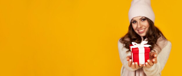 Portrait of happy woman enjoys a gift box