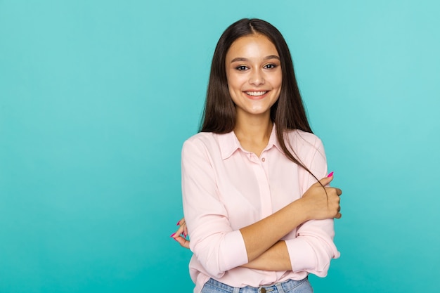 Photo portrait of happy woman isolated over the blue studio