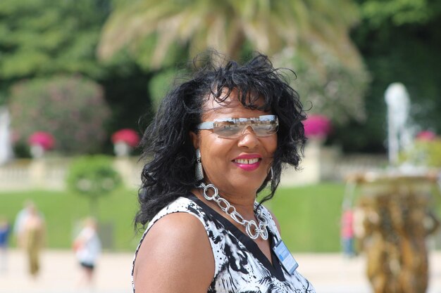 Portrait of happy woman at park