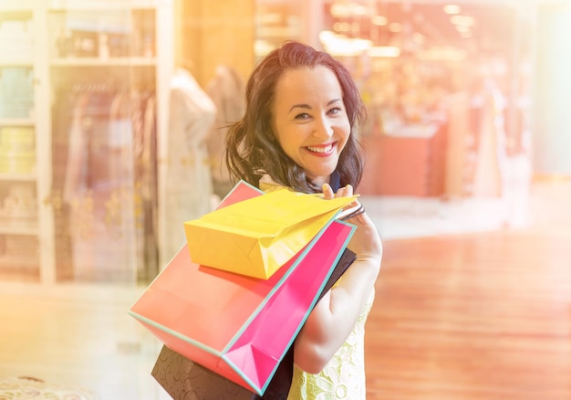 Portrait of happy woman shopping