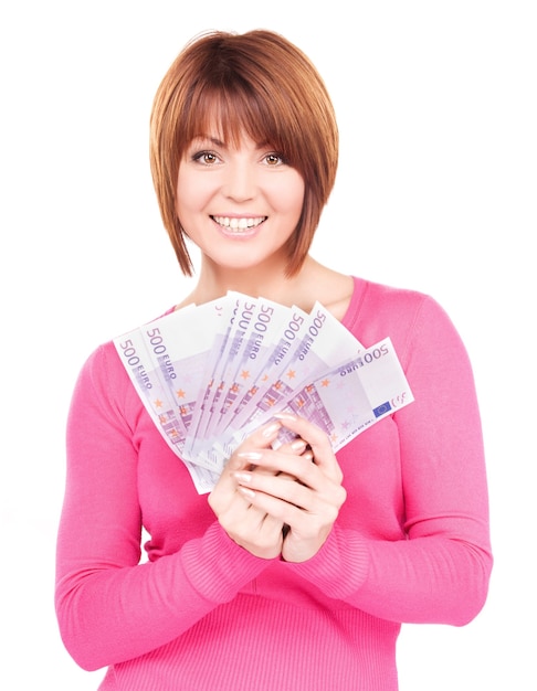 portrait of happy woman with money over white wall